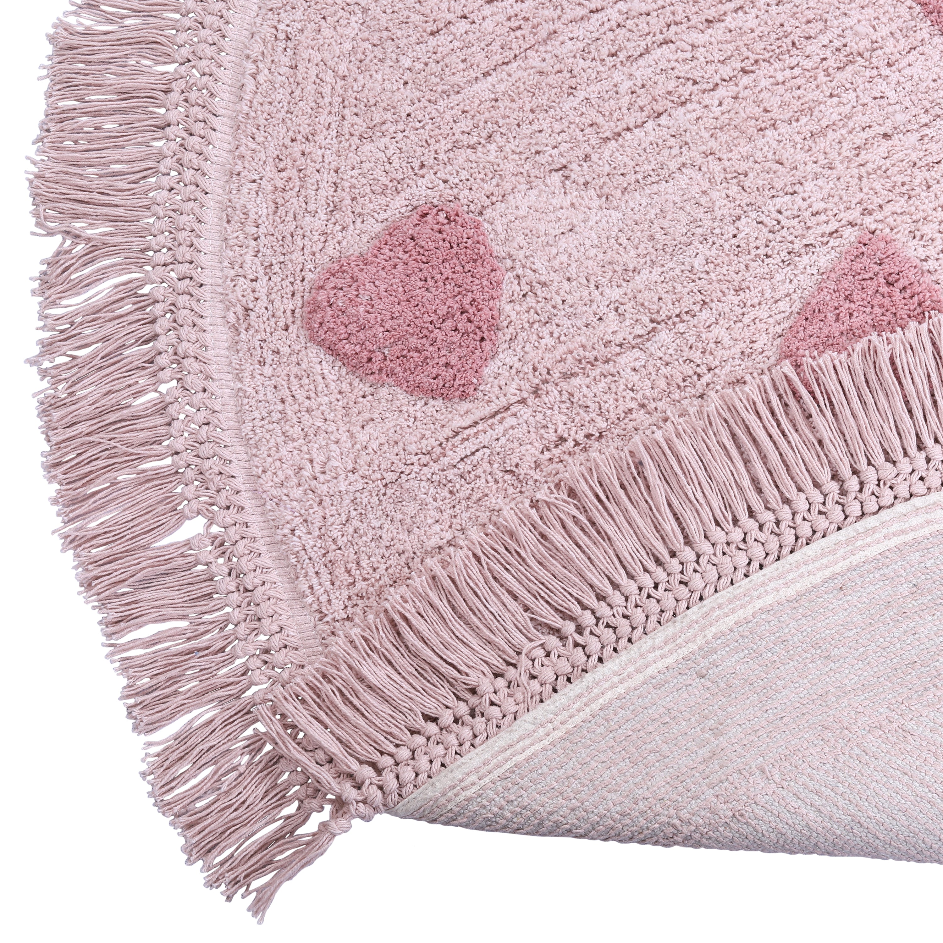 Decoratief vloerkleed met rosé hartjes, perfect voor meisjeskamer.